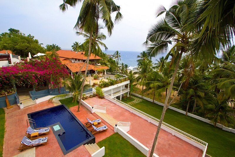 Getaway Beach Resort Kovalam — beachfront infinity pool at dawn
